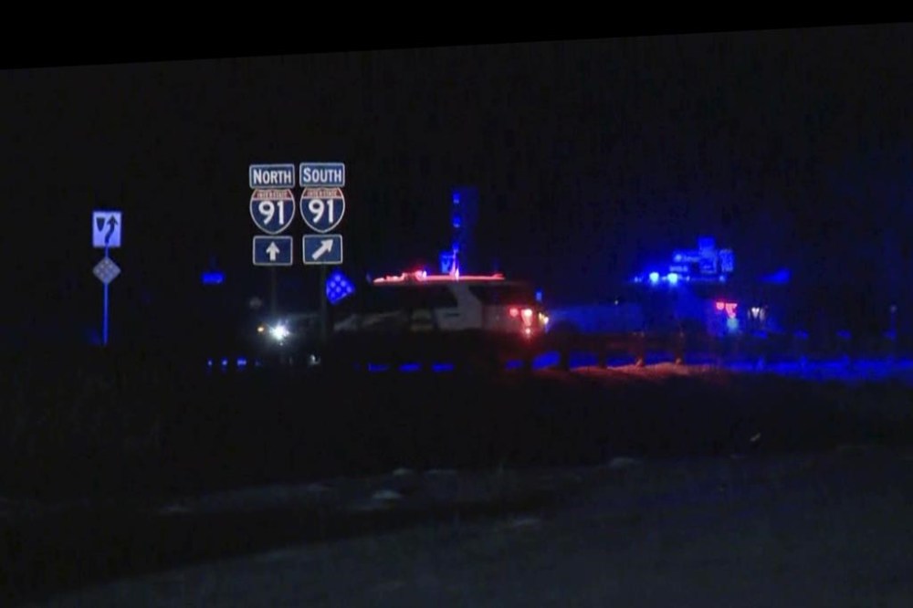 HOLD This image taken from video provided by WCAX shows police cars closing off a road after a shooting involving a U.S. Border Patrol agent on Interstate 91 near Coventry, Vt., Monday, Jan. 20, 2025. (WCAX via AP)