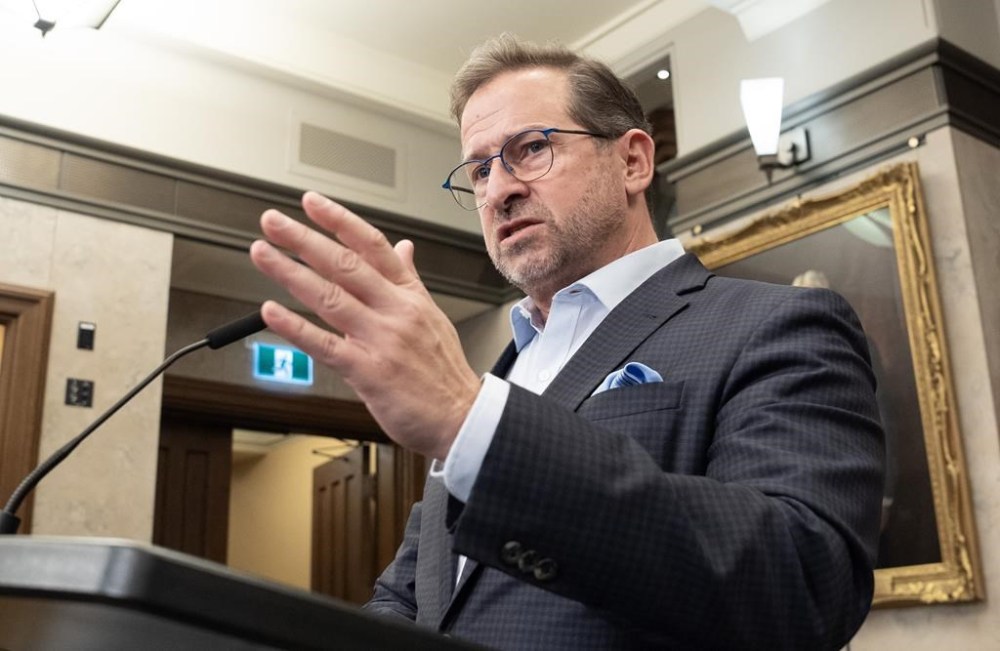 Bloc leader Yves-François Blanchet speaks with reporters in the foyer of the House of Commons, Tuesday, Dec 17, 2024 in Ottawa. THE CANADIAN PRESS/Adrian Wyld