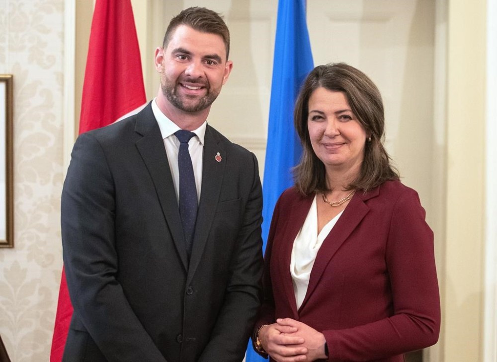Alberta Premier Danielle Smith and Minister of Mental Health and Addiction Dan Williams stand together during the swearing in of her cabinet in Edmonton, Friday, June 9, 2023. THE CANADIAN PRESS/Jason Franson
