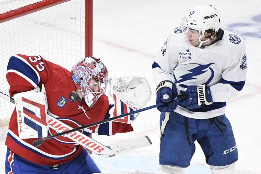 Tampa Bay Lightning's Brayden Point moves in on Montreal Canadiens goaltender Sam Montembeault during second period NHL hockey action in Montreal, Tuesday, January 21, 2025. THE CANADIAN PRESS/Graham Hughes