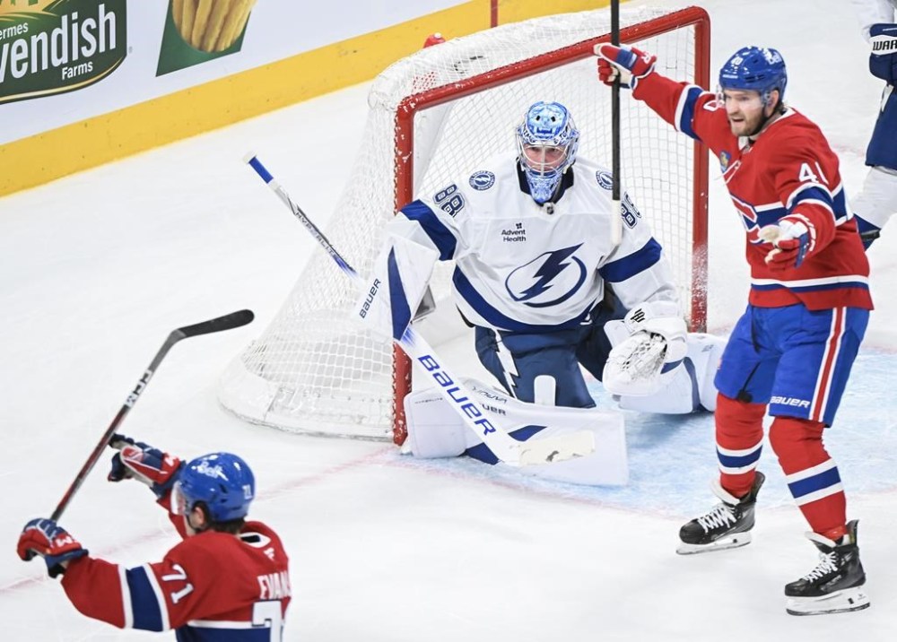 Tampa Bay Lightning goaltender Andrei Vasilevskiy is scored on by Montreal Canadiens' Jake Evans (71) as Canadiens' Joel Armia celebrates the goal during third period NHL hockey action in Montreal, Tuesday, January 21, 2025. THE CANADIAN PRESS/Graham Hughes