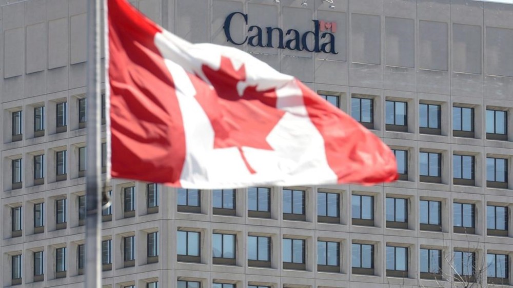 The facade of the headquarters of the Department of National Defence is pictured in Ottawa, on April 3, 2013. A Canadian military watchdog says Ottawa should financially compensate Afghan Canadians who served as translators for the armed forces in Afghanistan and suffered mental distress. THE CANADIAN PRESS/Adrian Wyld