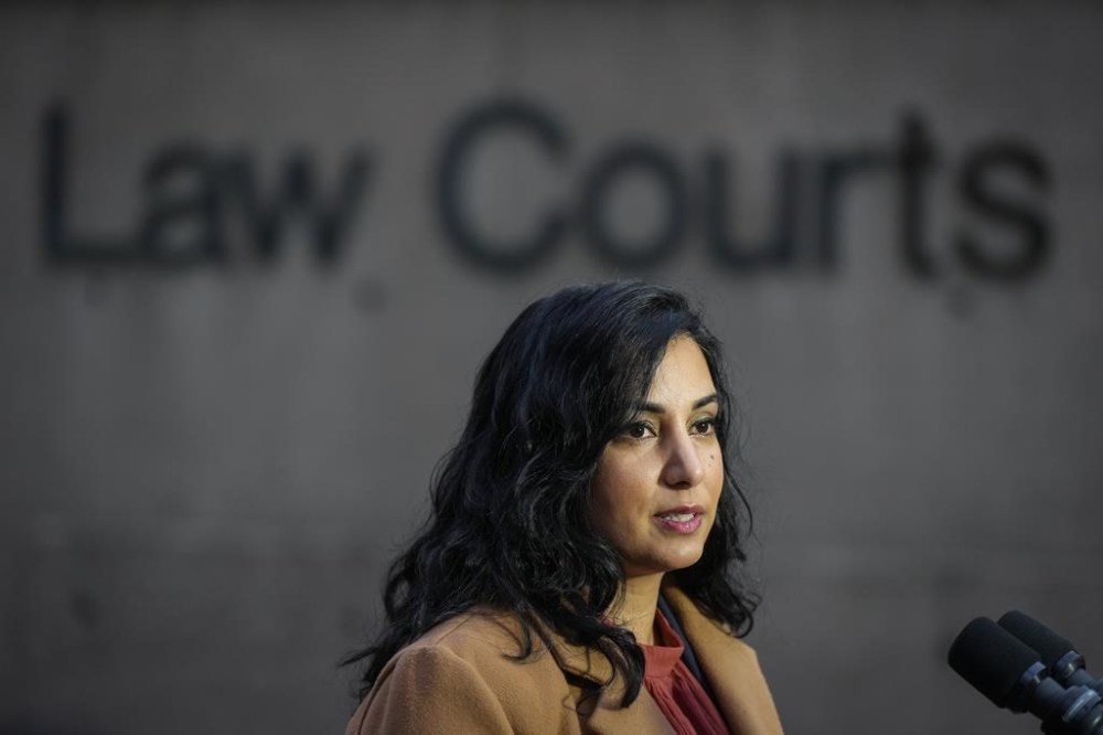 B.C. Attorney General Niki Sharma responds to questions outside B.C. Supreme Court in Vancouver on Monday November 27, 2023. The provincial government is challenging dozens of health care and pharmaceutical companies in court in a bid to get certification for a class-action lawsuit over the costs of the opioid crisis. THE CANADIAN PRESS/Darryl Dyck