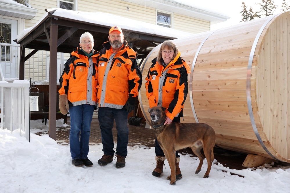Wendy Flannigan (right) and her Belgian Malinois Luke pose for a photo at their home in Brandon, along with longtime friends and fellow Brandon Regional Search and Rescue Association members — Paulette and Brian Fowell on Monday. The Fowells picked up Flannigan’s dog Luke after her husband Leon and the dog were in a serious car accident near Inglis, Manitoba in late November of last year. (Tim Smith/The Brandon Sun)