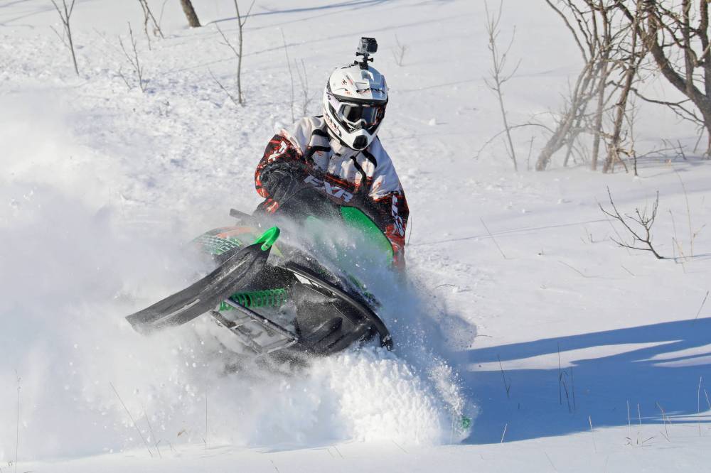 A rider plays in the deep snow near his home outside Minnedosa on his snowmobile on a blustery afternoon. (File/The Brandon Sun)