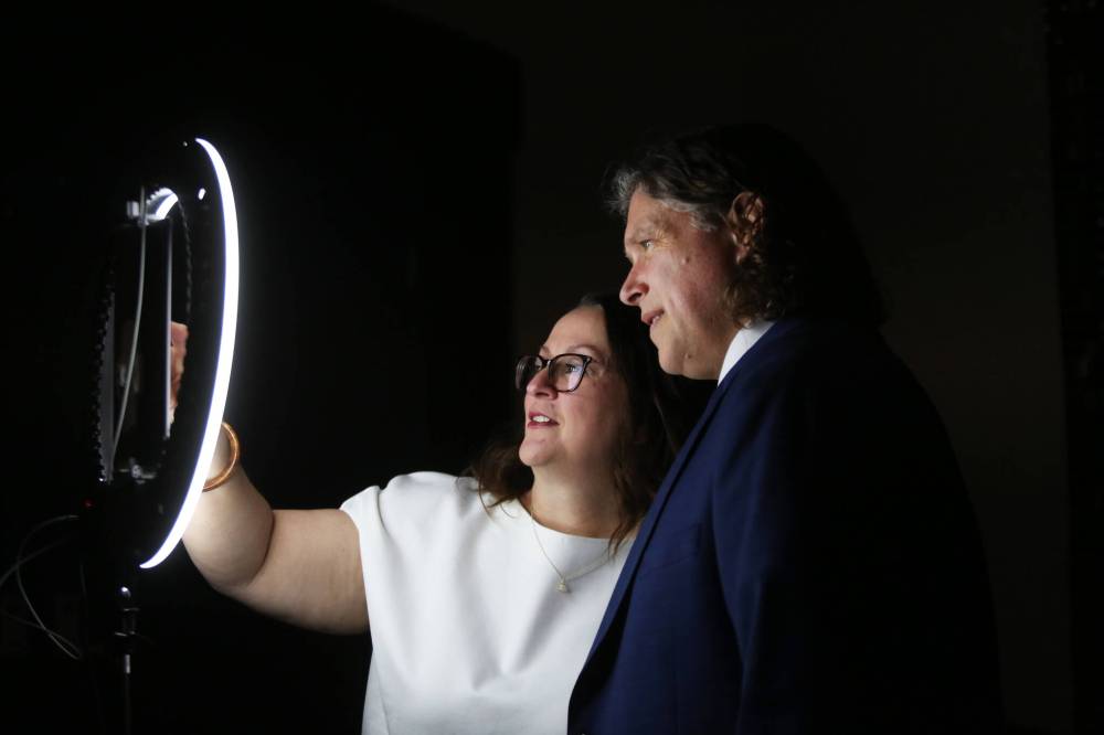 Jodi Fawcett looks through options on a computer screen after posing for a photo with her husband, Brandon Mayor Jeff Fawcett, at a special digital photo booth set up for the Provincial Exhibition of Manitoba’s President’s Dinner at the Victoria Inn in February.
