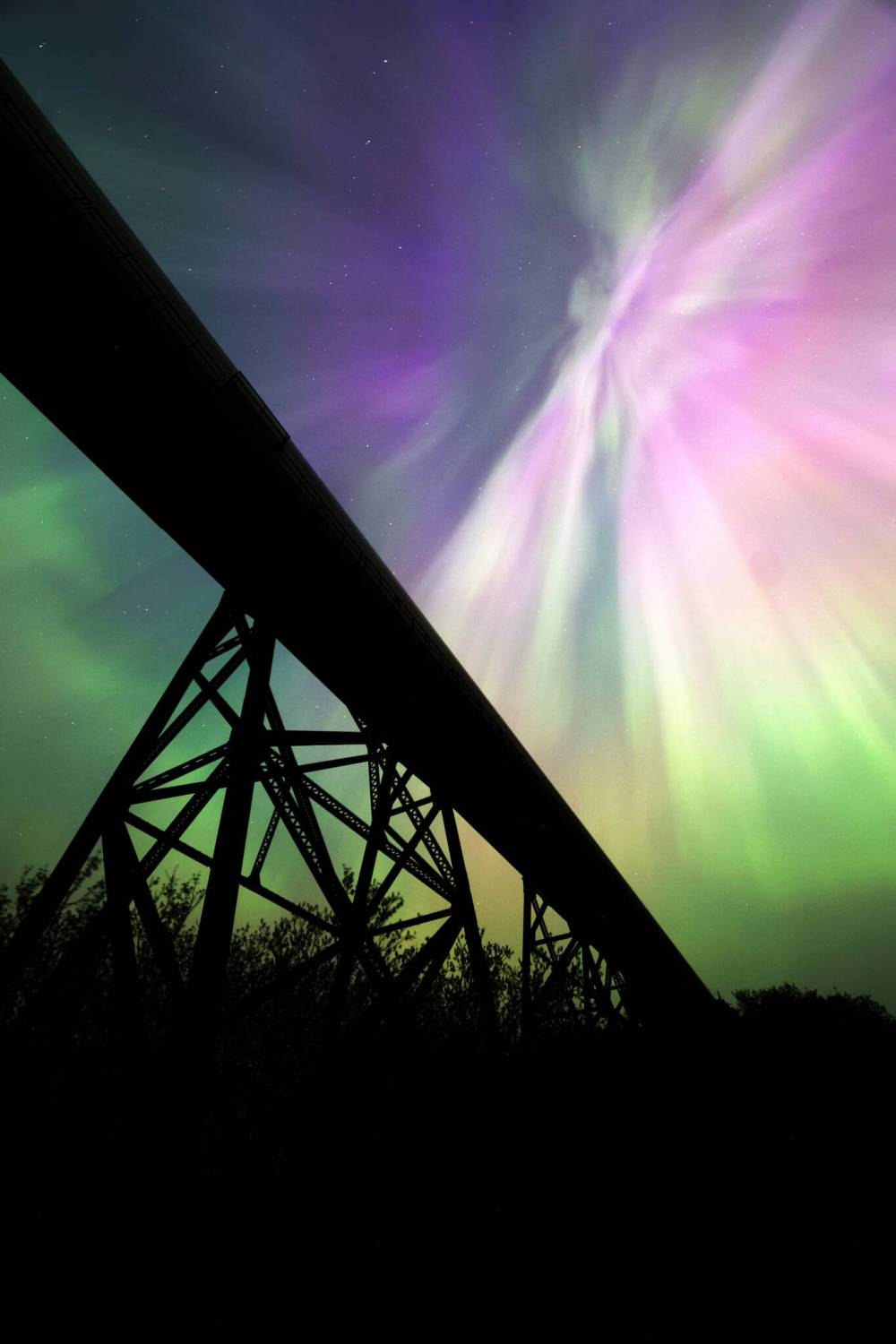 An explosion of colour from the aurora borealis fills the night sky over the railway trestle at Rivers in May. A severe geomagnetic storm — the strongest the earth has seen in 20 years — caused northern lights to be seen across the northern hemisphere as a result of several solar flares exploding off the sun.