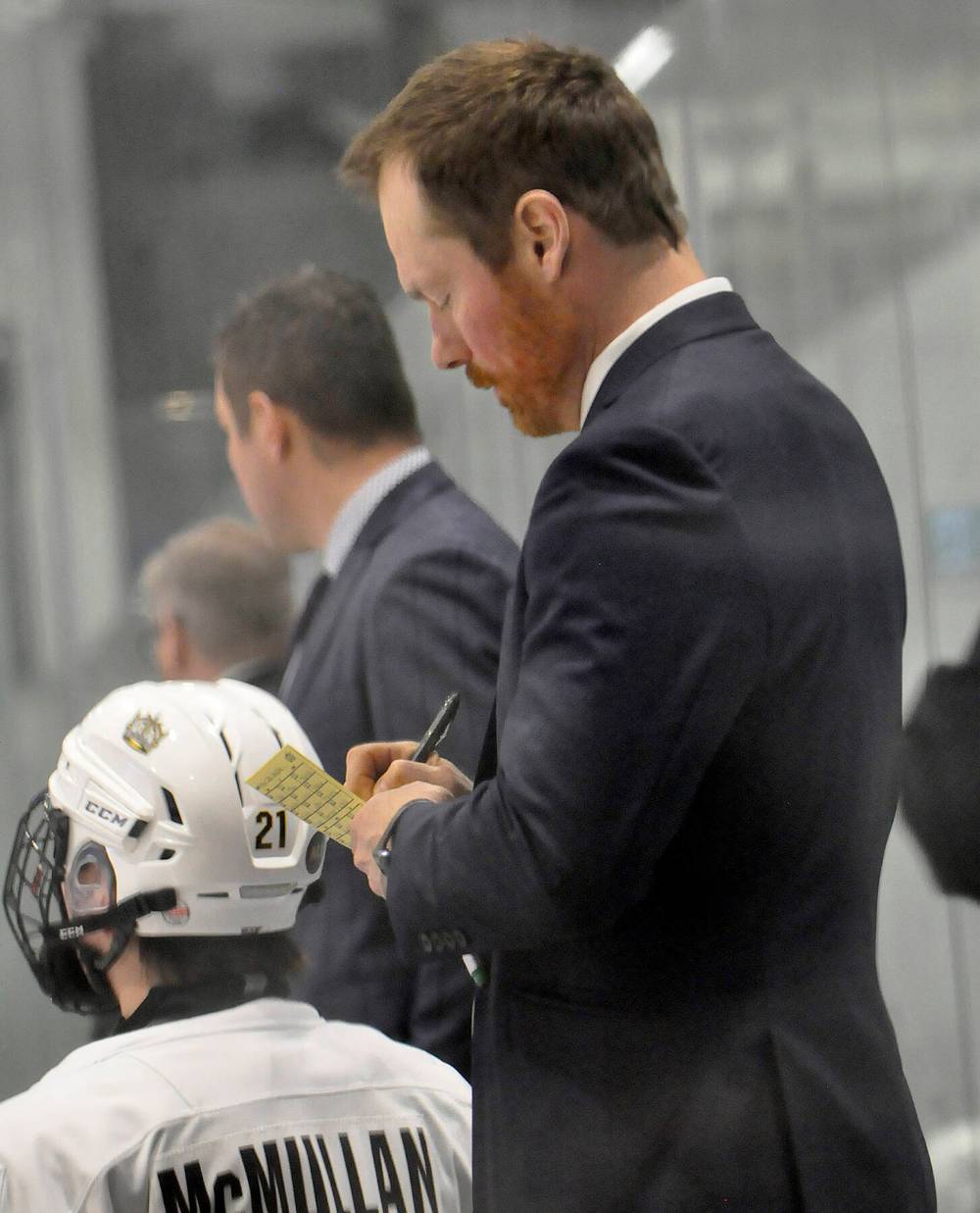 Wheat Kings U18 AAA coach Travis Mealy takes notes from the bench during a playoff game at J&G Homes Arena. (Brandon Sun files)