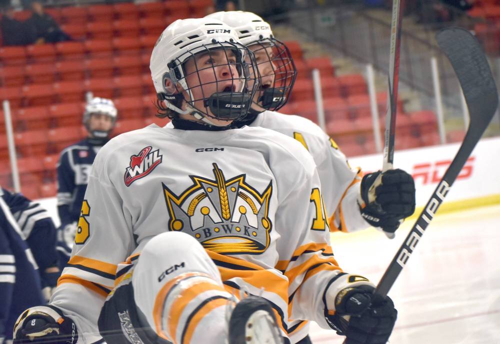 Brandon Wheat Kings forward Easton Odut celebrates with teammate Ethan Stewart after scoring his first of two goals during his team’s 7-4 victory over the Markham Waxers in Membertou, N.S. (Jeremy Fraser/Cape Breton Post)