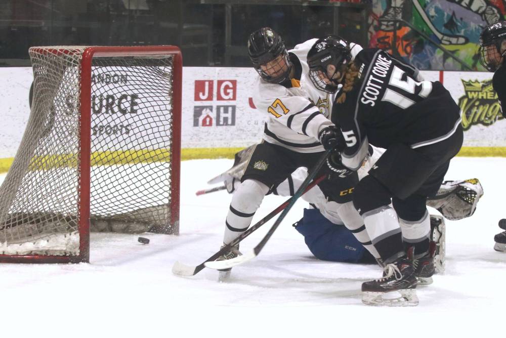 Eastman Selects forward Cheyenne Scott Cooke (15) fires the puck into a wide open net as Brandon Wheat Kings defender Chloe Kachur (17) looks on during Manitoba Female Hockey League U18 AAA at J&G Homes Arena on Sunday afternoon. The goal, which came off a rebound, put Eastman up 2-0 late in the first period. (Perry Bergson/The Brandon Sun)