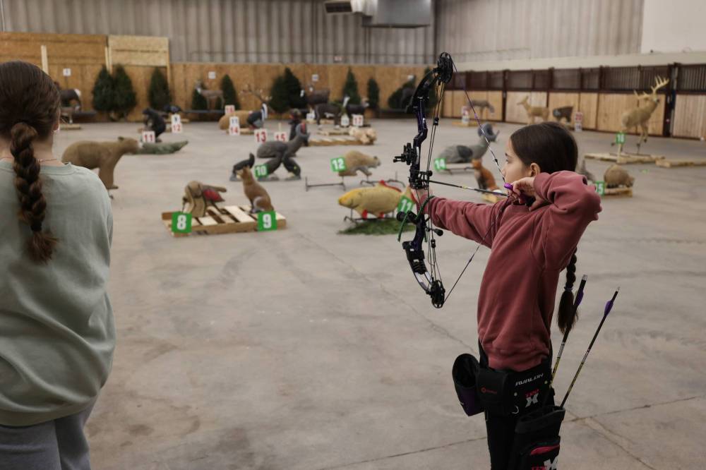 Nevaeh Sierens, 12, takes a shot during the 3D target shooting.