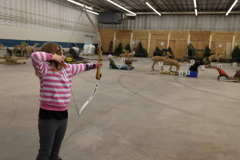 Rowan Allan-Fowlie, 7, aims at one of the 3D animal targets during the annual Indoor 3D Archery Shoot held at the Keystone Centre on Saturday morning. (Photos by Abiola Odutola/The Brandon Sun)