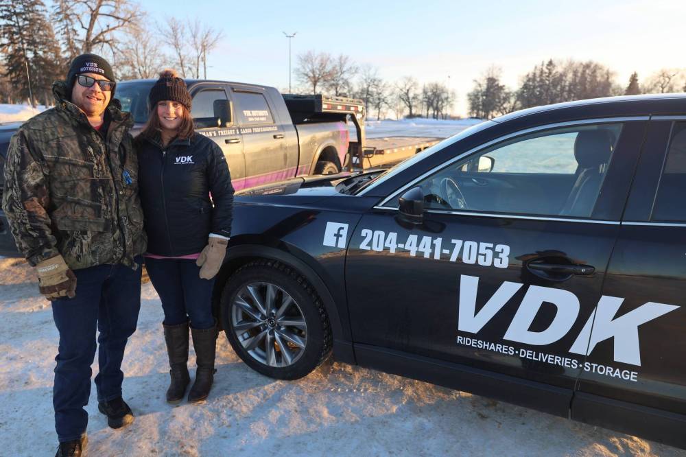 VDK Hotshot Freight Services owner Andrew Van De Kerckhove and his wife, Brigitte, the owner of VDK Delivery Services, pose for a picture outside the Keystone Centre on Saturday. (Abiola Odutola/The Brandon Sun)