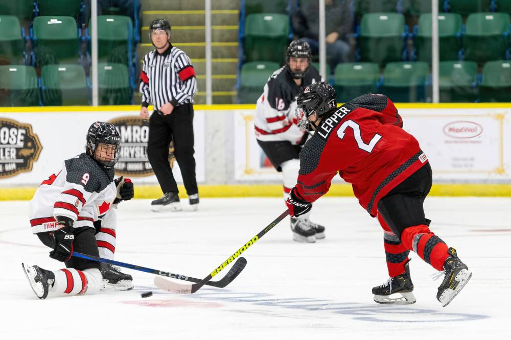 Luke Lepper of Brandon takes a slapshot during the round-robin against Canada East. (Tim Matwey/Hockey Canada Images)