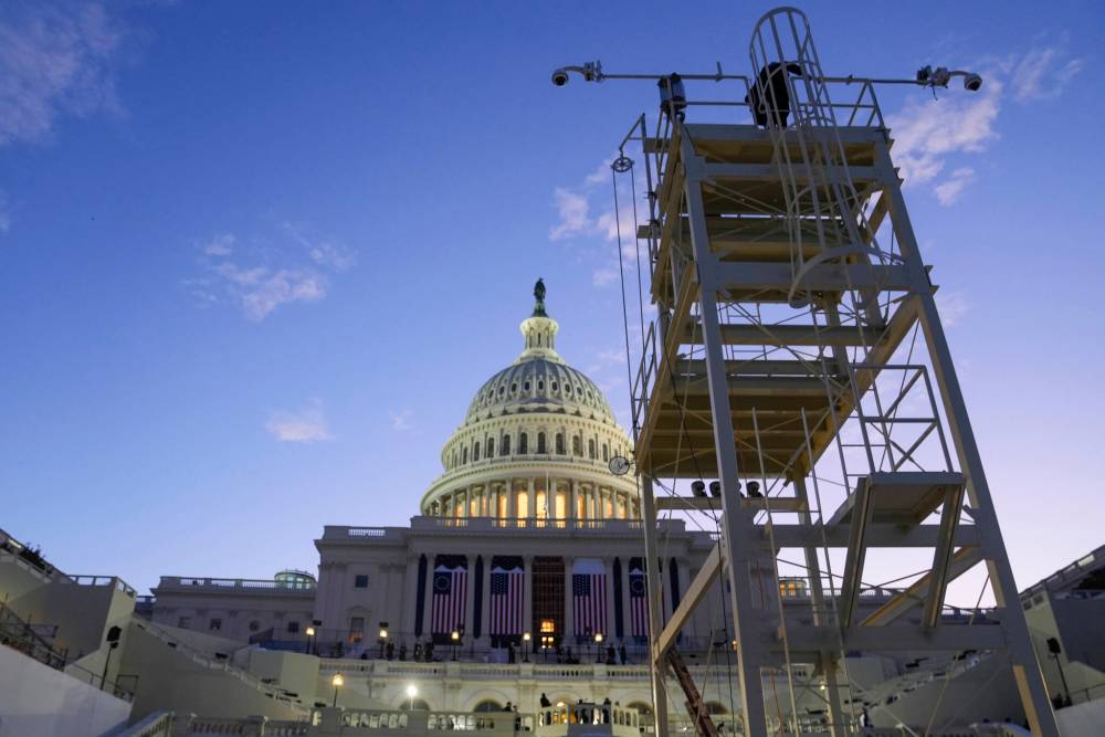 The sun rises behind the U.S. Capitol as a rehearsal takes place on the West Front on Sunday, ahead of president-elect Donald Trump’s upcoming inauguration in Washington. Columnist David McConkey has some tips for handling Trump’s return. (The Associated Press)