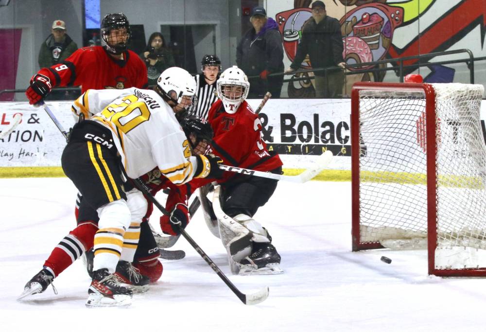 Brandon Wheat Kings forward Cole Lobreau (20) scores into an empty net behind Kenora Thistles goalie Brady Cates (35) as defenceman Jaden VanWalleghem looks on during Manitoba U18 AAA Hockey League action at J&G Homes Arena on Sunday afternoon. The goal in the second period put Brandon up 5-1, and they went on to post a 6-1 victory. (Perry Bergson/The Brandon Sun)
