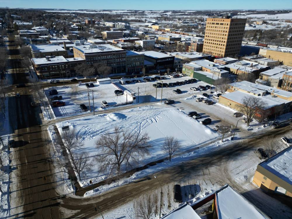 Empty lots along Princess Avenue between 10th Street and Ninth Street in downtown Brandon as seen from above. An empty lot on the corner of Ninth Street and Princess Avenue is being prospected as the site of a 90-unit residential building, City of Brandon director of planning Ryan Nickel said on Wednesday. (Tim Smith/The Brandon Sun)