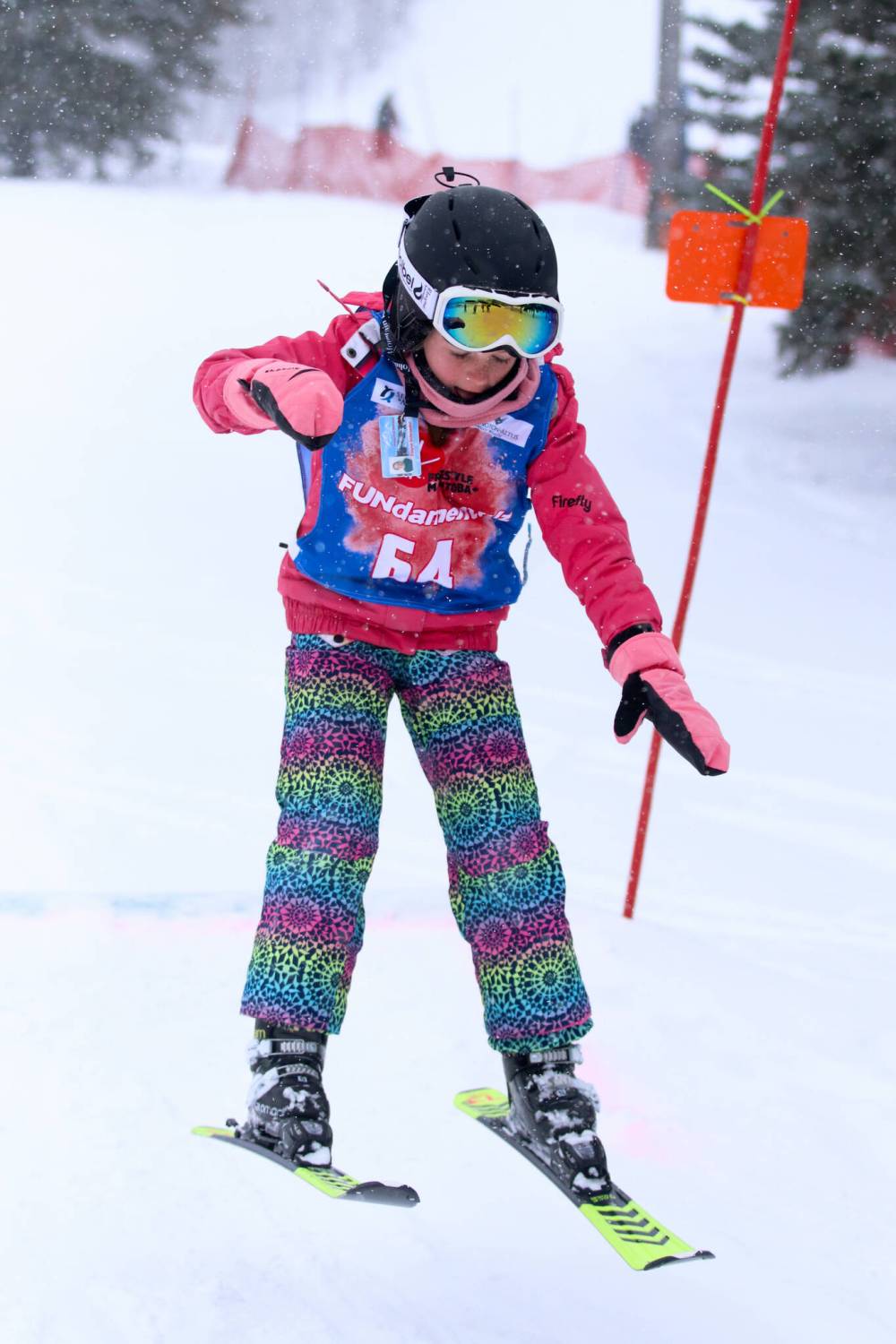 Eight-year-old Elayne Schroeder takes flight over a jump at as part of the Freestlye FUNdamentalz program at Holiday Mountain. (Matt Packwood/The Brandon Sun)