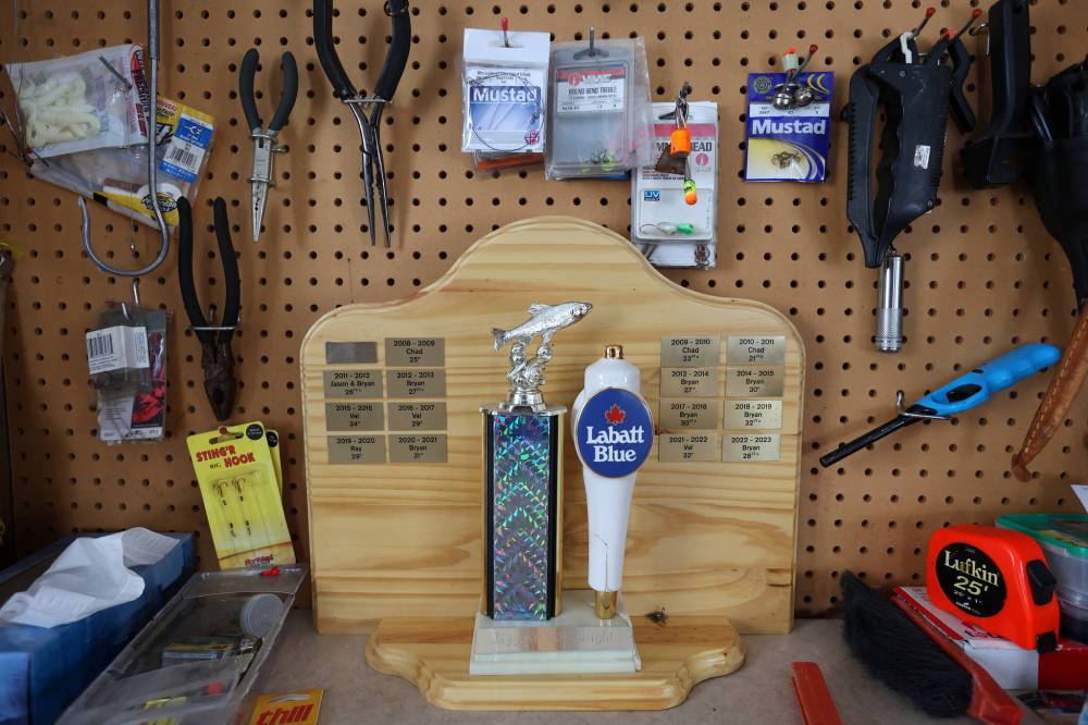 A trophy and fishing paraphernalia can be seen in Val and Bryan McFarlane’s ice-fishing shack on Minnedosa Lake. Each year, the McFarlanes have a competition among family members to see who can catch the most fish during the ice-fishing season. The winner gets their name on the trophy.