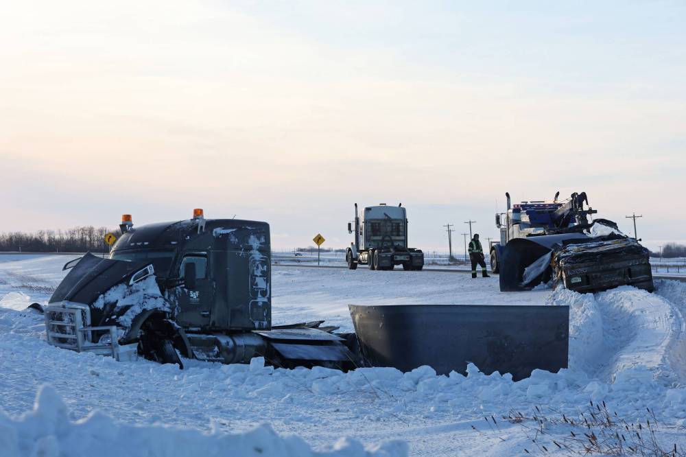 A damaged semi-trailer rests in the ditch between the eastbound and westbound lanes of the Trans-Canada Highway near Alexander on Friday afternoon. (Tim Smith/The Brandon Sun)