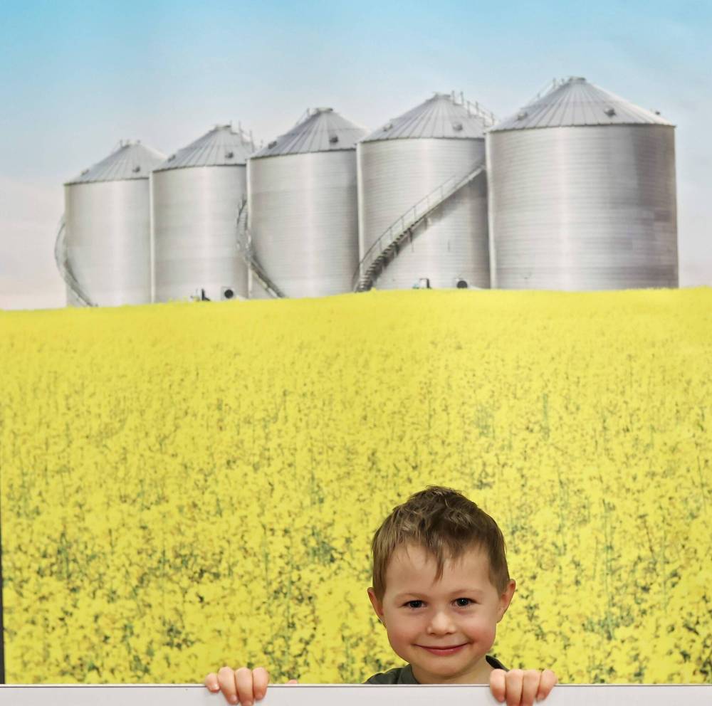 Four-year-old Nash (no last name given) from Gladstone peers out from a display during last year’s Manitoba Ag Days at the Keystone Centre. (Tim Smith/The Brandon Sun Files)