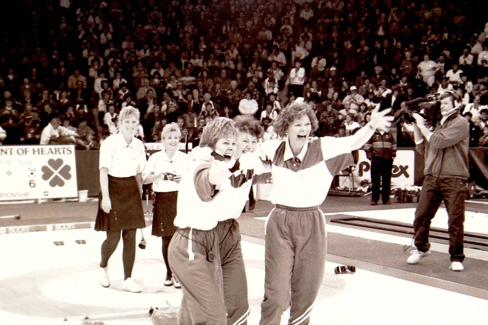 Manitoba's Maureen Bonar and Lois Fowler watch on as Team Saskatchewan celebrated winning the 1993 Scott Tournament of Hearts at the Keystone Centre. (Brandon Sun files)
