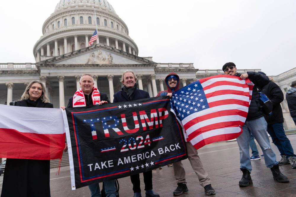 Supporters of president-elect Donald Trump take pictures as they celebrate outside of the U.S. Capitol yesterday in Washington. Columnist Thomas Klassen writes that history contains a guide to what we can expect during Trump’s second term. (The Associated Press)