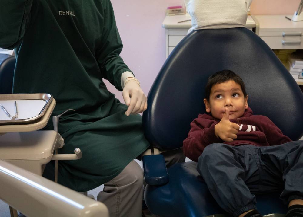 Rayden Morin, 5, sits in the dental chair for his first dental check-up on October 3, 2022. Justin Trudeau’s departure as Liberal party leader and the prorogation of Parliament has left the future of the Canadian Dental Care Plan in doubt. (File)