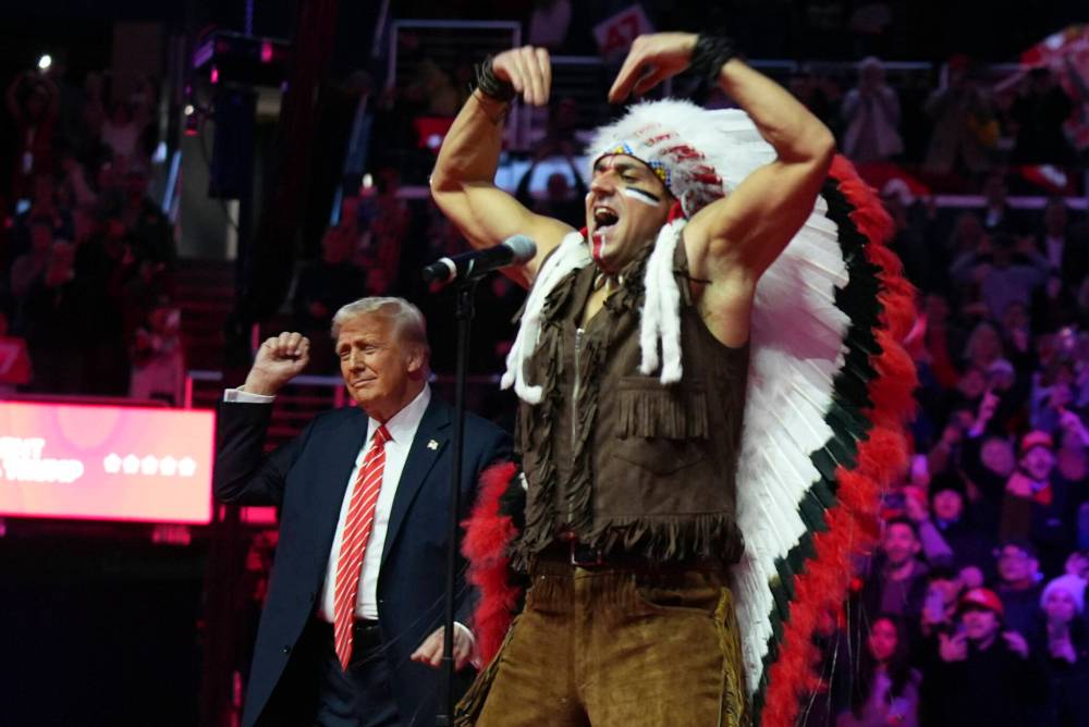 President-elect Donald Trump dances with The Village People yesterday at a rally ahead of the 60th Presidential Inauguration today in Washington. (The Associated Press)
