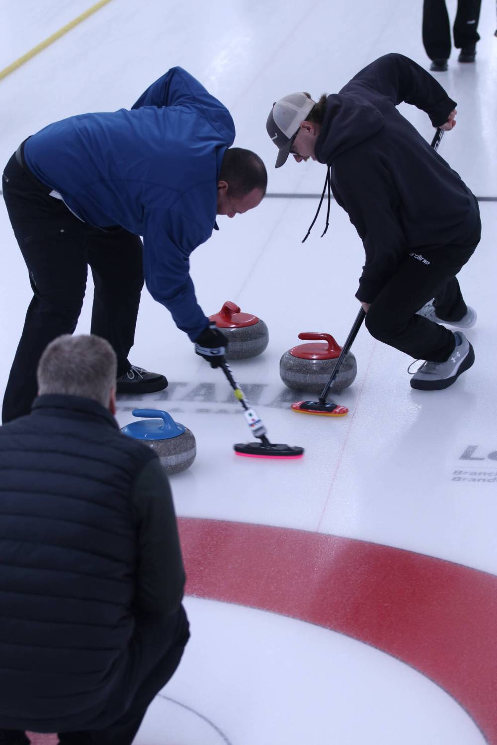 Mark Anderson's team brings a rock into the house in the men's B-side final of the Wheat City Classic at the Riverview Curling Club on Sunday. (Matt Packwood/The Brandon Sun)