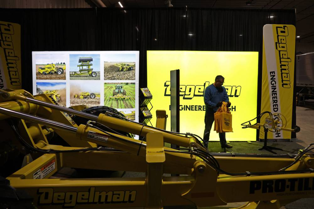 Chad Jones, director of sales with Degelman Industries, works to set up a booth ahead of Manitoba Ag Days at the Keystone Centre in Brandon on Monday. The three-day annual event starts today and runs until Thursday. (Photo by Tim Smith/The Brandon Sun)