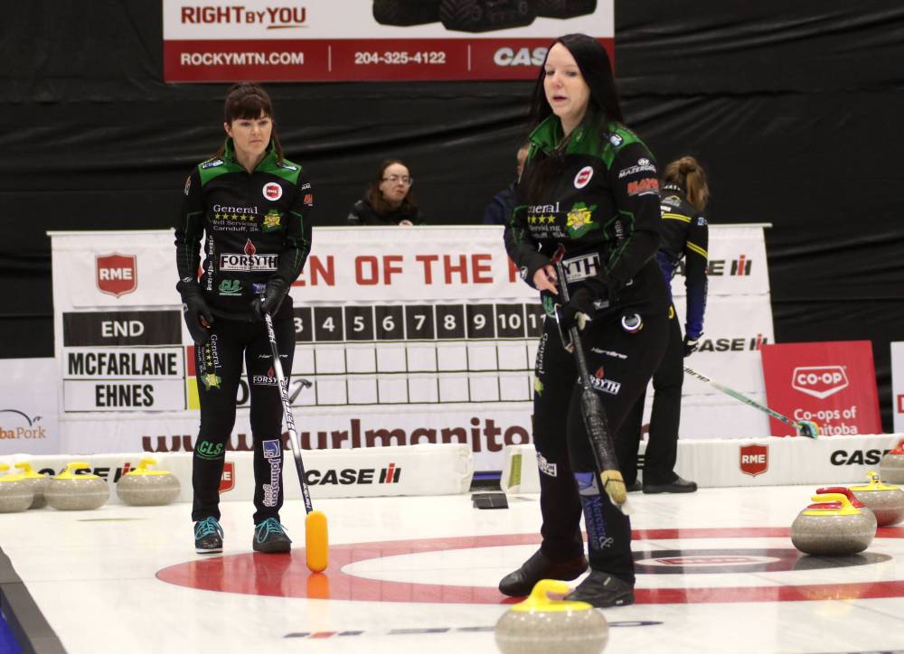 Neepawa’s Hailey McFarlane, right, and third Janelle Lach discuss a shot against Cheyenne Ehnes during their game at the RME Women of the Rings in Pilot Mound on Thursday. (Thomas Friesen/The Brandon Sun)