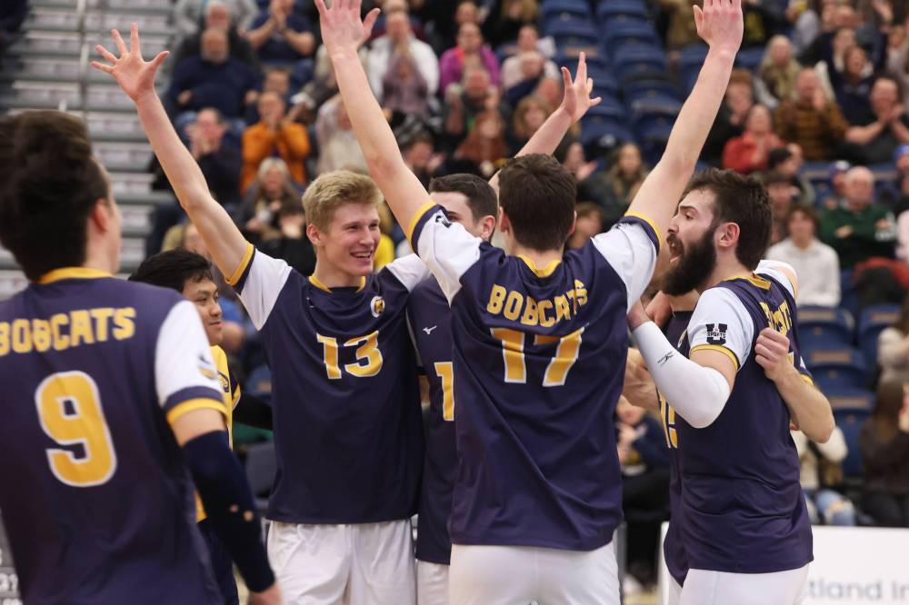 The Brandon University Bobcats celebrate their four-set win over the University of Fraser Valley Cascades at the BU Healthy Living Centre on Friday evening. (Tim Smith/The Brandon Sun)