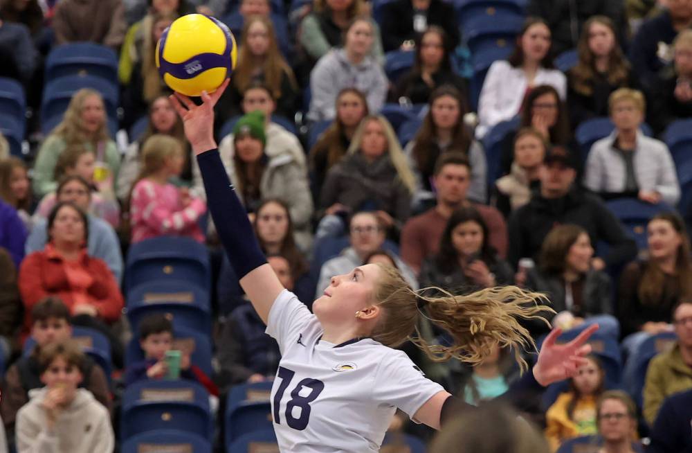 Cassidy Hauta of the Brandon University Bobcats puts the ball over the net during university volleyball action against the University of Fraser Valley Cascades at the BU Healthy Living Centre on Friday evening. (Tim Smith/The Brandon Sun)