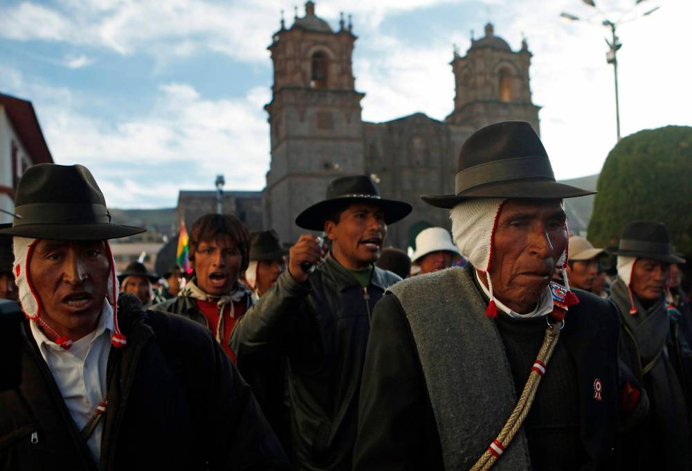 Demonstrators shout slogans during a protest in Puno, Peru on May 30, 2011. A blockade that paralyzed commerce and triggered violence in Desaguadero, had formed three weeks earlier, when residents began demanding Peru’s government revoke the licence for the Canadian-owned Santa Ana silver mine. (The Associated Press)