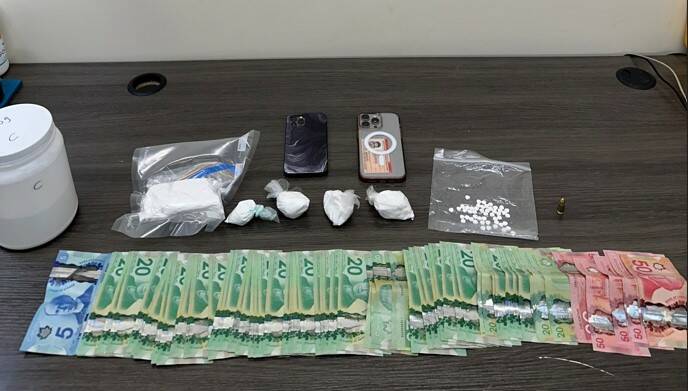 Portage la Prairie RCMP charged three individuals with trafficking cocaine, according to a press release put out by Manitoba RCMP on Tuesday. More than 280 grams of cocaine with an estimated street value of more than $28,000, cash and other drugs, were seized. (Submitted)