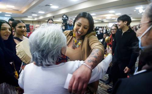 Kyra Wilson (centre), is congratulated by family and friends after the Assembly of Manitoba Chiefs (AMC) elected her as the grand chief in Winnipeg on Wednesday. First Nations leaders had to select a new head for the AMC after the sudden death of Cathy Merrick last year. (The Canadian Press)
