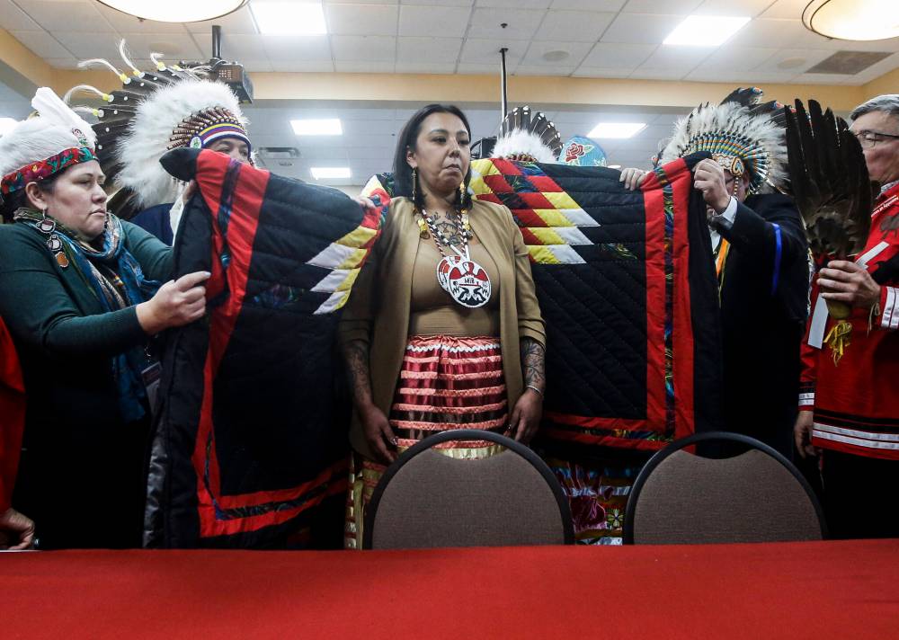 Kyra Wilson takes part in a ceremony after the Assembly of Manitoba Chiefs (AMC) elected her as the Grand Chief in Winnipeg on Wednesday. First Nations leaders had to select a new head for the AMC after the sudden death of Cathy Merrick last year. (The Canadian Press)