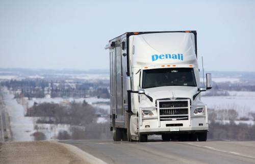 A freight truck from Saskatchewan climbs the slope along Highway 10 near the Brandon Hills, south of Brandon on Friday afternoon. Some companies in Manitoba have expedited their freight movements, ahead of today’s tariff implementation by the U.S. and to ward off any immediate trade disruptions. (Matt Goerzen/The Brandon Sun)