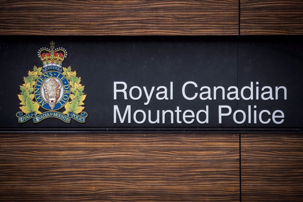 A man wanted for murder in a Toronto shooting that killed an up-and-coming rapper and a 28-year-old man has been arrested in Alberta. An RCMP logo is seen outside in Surrey, B.C., on Friday April 13, 2018. THE CANADIAN PRESS/Darryl Dyck