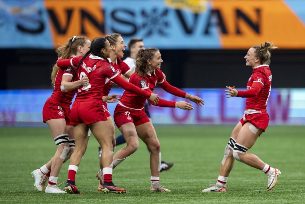 Canada's Krissy Scurfield, right, joins her teammates as they celebrate defeating the United States in Vancouver Sevens women's rugby action, in Vancouver, B.C., Saturday, Feb. 24, 2024. THE CANADIAN PRESS/Ethan Cairns