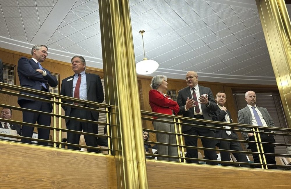 From left, North Dakota Republican Attorney General Drew Wrigley visits with state Supreme Court Justice Daniel Crothers on Wednesday, Dec. 4, 2024, in the balcony of the House of Representatives at the state Capitol in Bismarck, N.D., before Gov. Doug Burgum's budget address. The other members of the court, from left, are Justices Lisa Fair McEvers, Douglas Bahr, Chief Justice Jon Jensen and Justice Jerod Tufte. (AP Photo/Jack Dura)