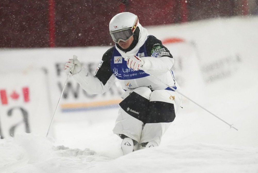 Japan's Ikuma Horishima skis in the qualification run of the men's World Cup freestyle skiing moguls in Saint-Come, Que., Friday, Jan. 31, 2025. Horishima overcame a wobbly start to edge Canadian star Mikael Kingsbury for gold at a moguls World Cup stop Friday. THE CANADIAN PRESS/Sean Kilpatrick
