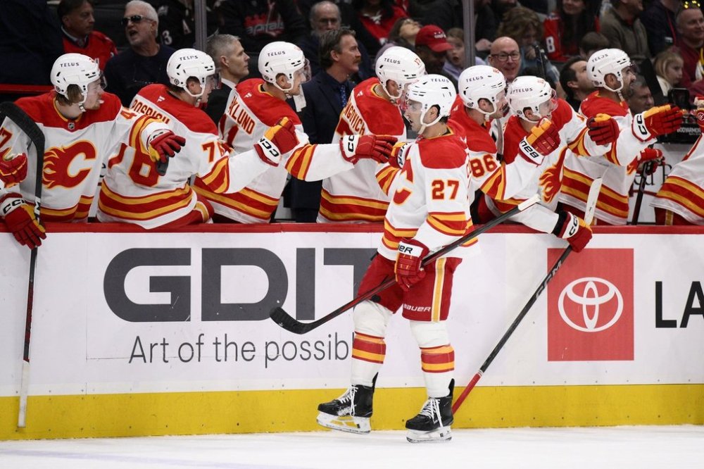 Calgary Flames right wing Matt Coronato (27) celebrates his goal during the first period of an NHL hockey game against the Washington Capitals, Tuesday, Feb. 25, 2025, in Washington. (AP Photo/Nick Wass)