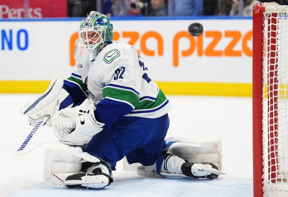 Vancouver Canucks goaltender Kevin Lankinen (32) makes a save against the Toronto Maple Leafs during second period NHL hockey action in Toronto on Saturday, January 11, 2025. The Canucks have signed Lankinen to a five-year contract extension with an average annual value of US$4.5 million, the club announced Friday. THE CANADIAN PRESS/Frank Gunn