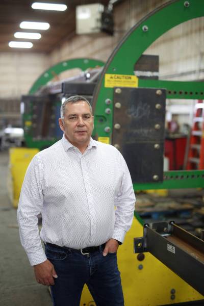 Atom-Jet Group owner Barry LaRocque stands in front of the Atom-Jet Industries shop in Brandon in a 2023 photo. (Tim Smith/The Brandon Sun files)