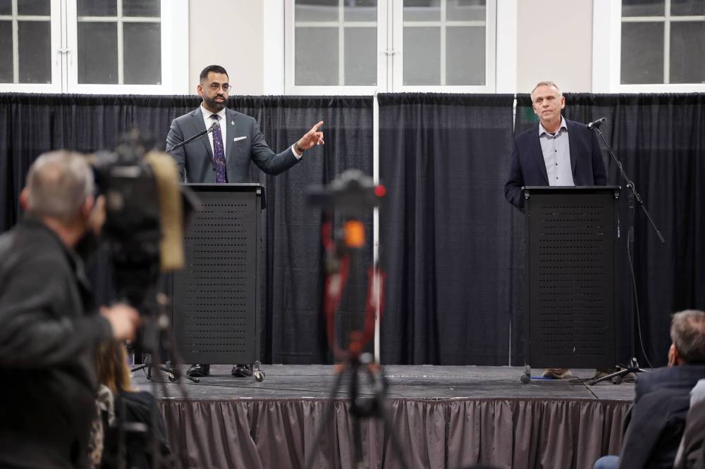 Progressive Conservative Party of Manitoba leadership candidates Obby Khan (left) and Wally Daudrich take part in a debate at The Dome Building in Brandon on Wednesday evening. (Tim Smith/The Brandon Sun)
