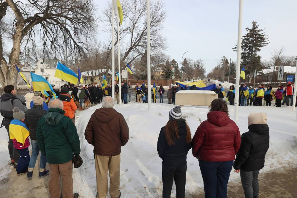Ukrainians based in Brandon and other residents gather for a flag raising in front of Brandon University.
