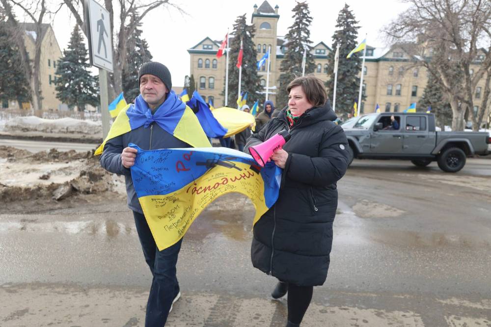 Ukrainian community in Brandon spokesperson Julia Krykavska (right) and others march from Brandon University to city hall in solidarity with Ukraine in its ongoing resistance to the Russian invasion, which began three years ago. (Photos by Abiola Odutola/The Brandon Sun)