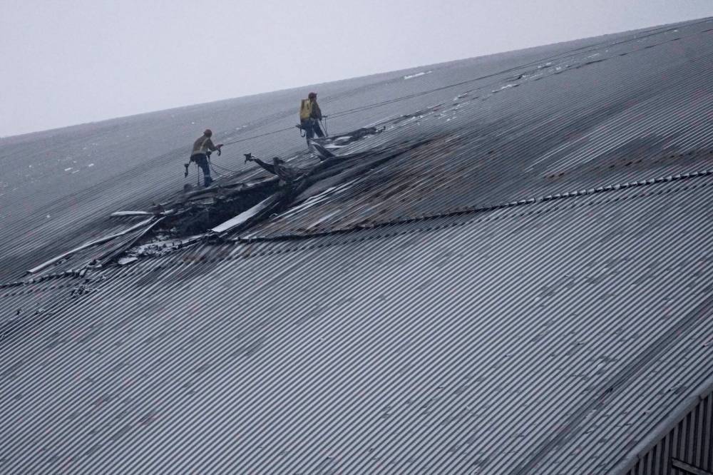 A view of the containment vessel that protects the remains of reactor number four at the former Chernobyl nuclear power plant and built to contain radiation, after a drone attack in Ukraine on Feb. 14. The use of drones in the Russo-Ukrainian war is one example of how there has been a shift in traditional warfare, École secondaire Neelin High School columnist C. Shaw writes. (The Associated Press)